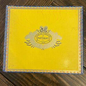 Vibrant Yellow and Blue Cigar Box with Decorative Emblem